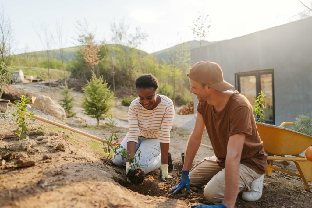 Two people gardening outside