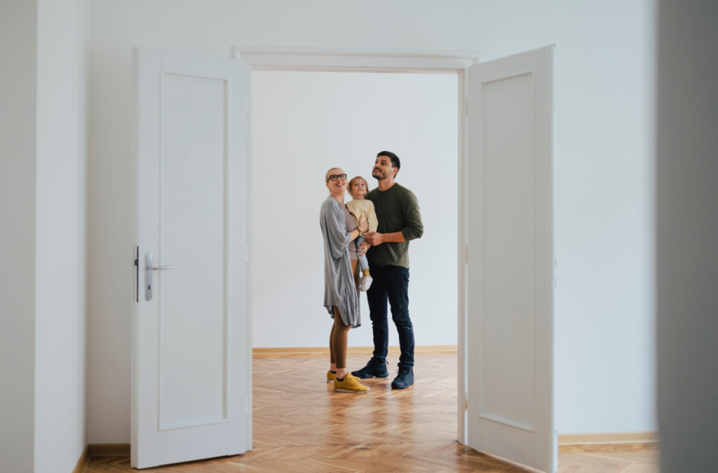 Family standing in new home