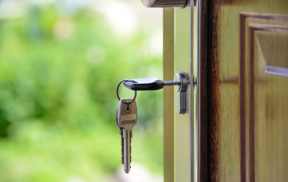 Image of keys in the door of a new house